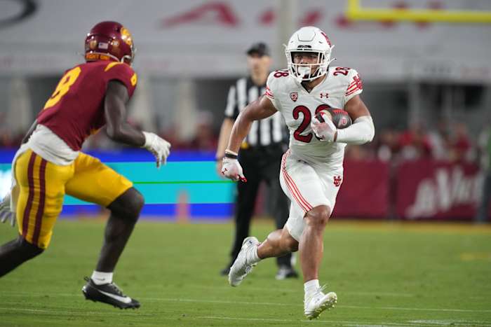 Oct 21, 2023; Los Angeles, California, USA; Utah Utes safety Sione Vaki (28) carries the ball against the Southern California Trojans in the first half at United Airlines Field at Los Angeles Memorial Coliseum. Mandatory Credit: Kirby Lee-USA TODAY Sports